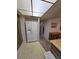 Bright kitchen space with a white refrigerator, neutral flooring, and wood cabinets at 3660 Haverhill St, Las Vegas, NV 89121