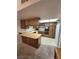 Functional kitchen features wood cabinets, a spacious countertop, and essential appliances at 3660 Haverhill St, Las Vegas, NV 89121