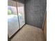 Enclosed patio featuring neutral patterned floors and a sliding glass door to the outdoor lounge area at 3660 Haverhill St, Las Vegas, NV 89121
