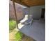 Outdoor patio area with two lounge chairs, covered with a wooden overhang at 3660 Haverhill St, Las Vegas, NV 89121