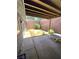 Covered patio with lounge chair, features a wooden beam ceiling, and a block wall at 3660 Haverhill St, Las Vegas, NV 89121