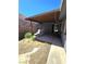 Backyard patio includes a wooden beam cover, two lounge chairs, and dry landscaping at 3660 Haverhill St, Las Vegas, NV 89121