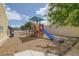 Community playground featuring a colorful play structure with a slide, perfect for outdoor fun at 3660 Haverhill St, Las Vegas, NV 89121