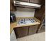 A gas stovetop with stainless steel vent and wood cabinets in a cozy kitchen at 3660 Haverhill St, Las Vegas, NV 89121