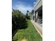 Lush backyard with green grass and a covered patio great for entertaining at 3805 White Castle St, Las Vegas, NV 89129