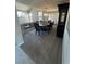 Formal dining room with neutral carpet, a chandelier, and views into the living room at 3805 White Castle St, Las Vegas, NV 89129
