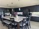 Modern kitchen with dark cabinets, a large center island, and stainless steel appliances at 3805 White Castle St, Las Vegas, NV 89129
