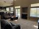 Spacious living room featuring carpeted floors, a fireplace, and sliding doors to the backyard at 3805 White Castle St, Las Vegas, NV 89129
