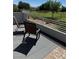 Outdoor patio seating overlooks a green space, providing a relaxing view and connection to nature at 3805 White Castle St, Las Vegas, NV 89129
