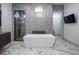 Luxurious bathroom with a standalone tub and modern fixtures at 4070 N Tee Pee Ln, Las Vegas, NV 89129