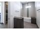 Bathroom featuring a sleek tub/shower combo with modern fixtures and minimalist design at 4070 N Tee Pee Ln, Las Vegas, NV 89129