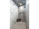 Contemporary shower featuring dual shower heads and marble-like tile at 4070 N Tee Pee Ln, Las Vegas, NV 89129