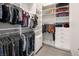 Spacious walk-in closet with custom shelving and hanging racks for organized storage at 4070 N Tee Pee Ln, Las Vegas, NV 89129