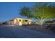 Well-maintained home featuring desert landscaping, a private driveway, and contemporary architectural style at 4070 N Tee Pee Ln, Las Vegas, NV 89129
