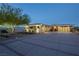 Stunning single story home with a modern design and elegant desert landscaping and oversized driveway at 4070 N Tee Pee Ln, Las Vegas, NV 89129