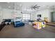 Versatile garage space converted to a playroom with gymnastic equipment and colorful modular blocks at 4070 N Tee Pee Ln, Las Vegas, NV 89129
