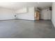 Clean and organized garage interior featuring cabinets, lighting and ample space at 4070 N Tee Pee Ln, Las Vegas, NV 89129
