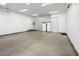 A spacious garage with ample room, complete with a refrigerator and cabinets for organized storage at 4070 N Tee Pee Ln, Las Vegas, NV 89129