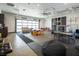 Multi-purpose garage transformed into a playroom with vibrant blocks, gymnastic rings, and soft seating at 4070 N Tee Pee Ln, Las Vegas, NV 89129