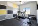 Home gym equipped with exercise machines and free weights at 4070 N Tee Pee Ln, Las Vegas, NV 89129