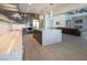 Open-concept kitchen featuring a spacious island, sleek countertops, and stainless steel appliances at 4070 N Tee Pee Ln, Las Vegas, NV 89129