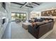 Bright living room with open-concept design and views to the back yard and connecting kitchen at 4070 N Tee Pee Ln, Las Vegas, NV 89129