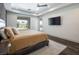 Stylish bedroom featuring dark wood floors and a large window at 4070 N Tee Pee Ln, Las Vegas, NV 89129