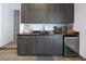Convenient mudroom area with cabinets, a sink, counter space and a beverage cooler at 4070 N Tee Pee Ln, Las Vegas, NV 89129