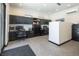 Spacious office boasts dual workstations, stylish black cabinetry, and climate control for a productive workspace at 4070 N Tee Pee Ln, Las Vegas, NV 89129