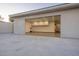 Spacious open garage with bright lighting and storage cabinets providing ample room at 4070 N Tee Pee Ln, Las Vegas, NV 89129