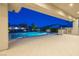 Inviting pool area with an outdoor kitchen under a covered patio offering a perfect space for outdoor gatherings at 4070 N Tee Pee Ln, Las Vegas, NV 89129