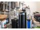 A well-equipped utility room with water filtration and heating system, plus ample shelving for storage solutions at 4070 N Tee Pee Ln, Las Vegas, NV 89129