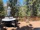 Deck with wooded views and dining set at 4125 Tyrol Way, Las Vegas, NV 89124