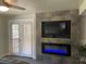 Bedroom featuring an electric fireplace and french doors to outside at 4125 Tyrol Way, Las Vegas, NV 89124
