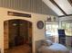 Comfortable bedroom with a fireplace, game console, and access to an outdoor deck at 4125 Tyrol Way, Las Vegas, NV 89124