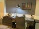Office space with a gray accent wall, a large desk, and stylish decor at 4125 Tyrol Way, Las Vegas, NV 89124