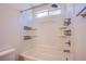Clean bathroom with a shower-tub combination and built-in shelving at 433 Royal Bridge Dr, Las Vegas, NV 89178