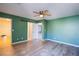 Spacious bedroom featuring wood floors, ceiling fan, and neutral-colored walls at 433 Royal Bridge Dr, Las Vegas, NV 89178