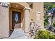 Close-up of front door with decorative glass detail and address number, enhanced by manicured landscaping at 433 Royal Bridge Dr, Las Vegas, NV 89178