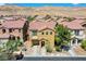 Charming two-story home with a balcony, manicured landscaping, and a well-maintained front yard at 433 Royal Bridge Dr, Las Vegas, NV 89178