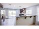 Well-lit kitchen features stainless appliances, granite counters and access to the backyard at 433 Royal Bridge Dr, Las Vegas, NV 89178