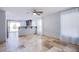Bright living room with tiled floors, ceiling fan, and sliding glass door to the backyard at 433 Royal Bridge Dr, Las Vegas, NV 89178