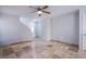 Spacious living room with tile flooring, ceiling fan, and neutral paint, ready for personalization at 433 Royal Bridge Dr, Las Vegas, NV 89178