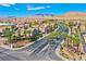 Street view showcasing a Primary-planned community with well-maintained landscaping, palm trees, and mountain views at 433 Royal Bridge Dr, Las Vegas, NV 89178