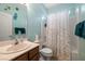 Well-lit bathroom with a shower-tub combo, and a single sink vanity at 4410 S Gressa St, Pahrump, NV 89061