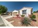 Single-story home featuring desert landscaping and a two-car garage at 4410 S Gressa St, Pahrump, NV 89061