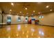 Spacious gym featuring wooden floors, fitness equipment, and natural light from the windows for a refreshing workout at 4410 S Gressa St, Pahrump, NV 89061