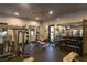 Well-equipped gym with weight racks, benches, mirrors, and ample space for a comprehensive fitness routine at 4410 S Gressa St, Pahrump, NV 89061