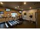 Modern gym with multiple treadmills, elliptical machines, and wall-mounted TVs for an engaging workout experience at 4410 S Gressa St, Pahrump, NV 89061