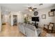 Bright living room featuring a ceiling fan, decor, tile floors, and comfortable seating at 4410 S Gressa St, Pahrump, NV 89061